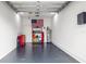 Clean garage space with an American flag, a red tool chest, and ample storage at 4104 E Comanche Ave, Tampa, FL 33610