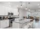 Modern kitchen featuring stainless steel appliances, granite countertops, and an island with seating at 4104 E Comanche Ave, Tampa, FL 33610