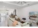 Bright living room with modern decor and an open layout, flowing into the kitchen at 4104 E Comanche Ave, Tampa, FL 33610