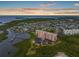 Panoramic aerial view of waterfront condominium complex at sunset showing docks and gorgeous water views at 4516 Seagull Dr # 614, New Port Richey, FL 34652