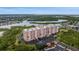 Overhead view of the condo complex overlooking bay with surrounding nature at 4516 Seagull Dr # 614, New Port Richey, FL 34652