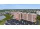 Stunning aerial view of a luxury condo building with a parking lot, situated near the waterfront at 4516 Seagull Dr # 614, New Port Richey, FL 34652