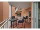 Cozy outdoor balcony with seating and barbecue, ideal for enjoying warm weather and casual dining at 4516 Seagull Dr # 614, New Port Richey, FL 34652