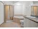 Bright bathroom featuring a soaking tub and glass shower at 4516 Seagull Dr # 614, New Port Richey, FL 34652