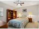 Comfortable bedroom with bookshelves and ceiling fan at 4516 Seagull Dr # 614, New Port Richey, FL 34652