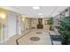 Well-maintained hallway with elevators, decorative flooring, and ample lighting at 4516 Seagull Dr # 614, New Port Richey, FL 34652