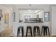 Modern kitchen with stainless steel appliances, bar seating, and open layout at 4516 Seagull Dr # 614, New Port Richey, FL 34652