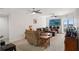 Living area with ceiling fans, plenty of seating, and a large entertainment center at 4516 Seagull Dr # 614, New Port Richey, FL 34652