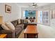 Comfortable living room features large windows and a cozy, plush couch for relaxing or entertaining at 4516 Seagull Dr # 614, New Port Richey, FL 34652