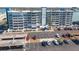 Aerial view of a condominium building and covered parking with waterfront view at 500 Treasure Island Cswy # 402, Treasure Island, FL 33706