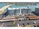 Condominium building with parking, set against a scenic waterfront backdrop at 500 Treasure Island Cswy # 402, Treasure Island, FL 33706