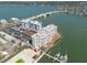 An aerial view showing the condos, surrounding waterway, and boat docks at 500 Treasure Island Cswy # 402, Treasure Island, FL 33706
