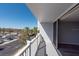 Balcony with a sunny view of a parking lot, palm trees and buildings at 500 Treasure Island Cswy # 402, Treasure Island, FL 33706