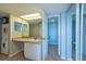 Bright bathroom features a modern vanity, and a convenient washer and dryer setup at 500 Treasure Island Cswy # 402, Treasure Island, FL 33706