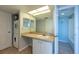 This bathroom features a vanity with ample counter space and a convenient washer/dryer at 500 Treasure Island Cswy # 402, Treasure Island, FL 33706