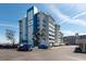 Large building with balconies and manicured landscaping at 500 Treasure Island Cswy # 402, Treasure Island, FL 33706