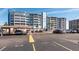 Multi-story building showcasing ample parking at 500 Treasure Island Cswy # 402, Treasure Island, FL 33706