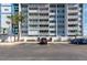 Condominium building featuring multiple stories with balconies and parking spaces at 500 Treasure Island Cswy # 402, Treasure Island, FL 33706