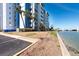 Well-maintained lawn adjoins the calm waters of the adjacent waterway at 500 Treasure Island Cswy # 402, Treasure Island, FL 33706