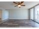 Spacious living room featuring wood floors and sliding glass doors to balcony at 500 Treasure Island Cswy # 402, Treasure Island, FL 33706