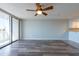 Cozy living area with wood flooring and access to a private balcony at 500 Treasure Island Cswy # 402, Treasure Island, FL 33706