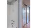 Shower/tub in a bathroom with sliding mirrored door to a room with a ceiling fan at 500 Treasure Island Cswy # 402, Treasure Island, FL 33706