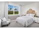 Bright bedroom featuring natural light, a comfortable chair, and a unique headboard design at 5220 124Th E Ave, Parrish, FL 34219