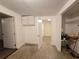 View of basement featuring carpeting, storage shelving, and neutral colors at 5439 County Road 579, Seffner, FL 33584