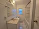 Bathroom with tiled floors, a vanity, and a combined tub and shower at 5439 County Road 579, Seffner, FL 33584