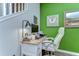 Cozy office space with a desk, modern chair, and stylish decor, featuring a pop of green color at 5703 Colony Glen Rd, Lithia, FL 33547