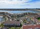 Overhead shot showcasing a waterfront community with a bridge, beach access, and well-kept grounds at 6021 Bahia Del Mar Cir # 234, St Petersburg, FL 33715