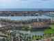 Aerial panorama of waterfront condos with lush landscaping, a water feature, and waterfront access at 6021 Bahia Del Mar Cir # 234, St Petersburg, FL 33715