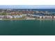 Wide aerial shot of waterfront condominiums with a beach, pool, and boat access on the water at 6021 Bahia Del Mar Cir # 234, St Petersburg, FL 33715