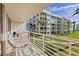 Wide balcony overlooking beautifully landscaped lawns and the building's exterior at 6021 Bahia Del Mar Cir # 234, St Petersburg, FL 33715