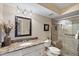 Bathroom with a granite countertop vanity and glass-enclosed shower with a built-in bench at 6021 Bahia Del Mar Cir # 234, St Petersburg, FL 33715