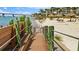 Private beach access via boardwalk and a glimpse of the bridge and waterfront at 6021 Bahia Del Mar Cir # 234, St Petersburg, FL 33715