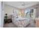Comfortable bedroom featuring neutral tones, a ceiling fan, and a window with blinds at 6021 Bahia Del Mar Cir # 234, St Petersburg, FL 33715