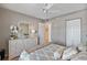 Cozy bedroom features neutral tones, ceiling fan, and white wicker furniture at 6021 Bahia Del Mar Cir # 234, St Petersburg, FL 33715