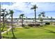 Serene waterfront setting with pool and lounge area surrounded by manicured green spaces at 6021 Bahia Del Mar Cir # 234, St Petersburg, FL 33715