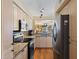 Modern kitchen with stainless steel appliances, granite countertops, and ample cabinet space with backyard views at 6021 Bahia Del Mar Cir # 234, St Petersburg, FL 33715