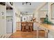 Charming kitchenette with breakfast bar, complete with warm lighting and views to the living area at 6021 Bahia Del Mar Cir # 234, St Petersburg, FL 33715