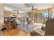 Bright living room features a large sofa, mirrored wall, and sliding glass doors to the balcony at 6021 Bahia Del Mar Cir # 234, St Petersburg, FL 33715