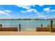 Scenic waterfront view from the deck with seating overlooking the tranquil water and distant shoreline at 6021 Bahia Del Mar Cir # 234, St Petersburg, FL 33715