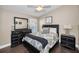 Comfortable bedroom featuring a queen-size bed, hardwood floors, and neutral decor with great natural light at 632 Addison Ne Dr, St Petersburg, FL 33716