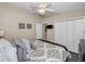 Bedroom features hardwood floors and a ceiling fan at 632 Addison Ne Dr, St Petersburg, FL 33716