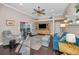 Spacious living room with ceiling fan, hardwood floors and a view of the pool at 632 Addison Ne Dr, St Petersburg, FL 33716
