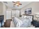 Comfortable main bedroom with hardwood floors, ceiling fan and ensuite bathroom access at 632 Addison Ne Dr, St Petersburg, FL 33716