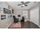 Office with dark wood floors, ceiling fan, closet and lots of wall decor at 632 Addison Ne Dr, St Petersburg, FL 33716