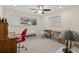 Bedroom featuring two workstations, a ceiling fan, and natural lighting at 8000 13Th S Ave, St Petersburg, FL 33707