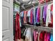 Walk-in closet featuring a large selection of clothing hanging from metal shelving at 8000 13Th S Ave, St Petersburg, FL 33707